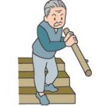 手すりを使って階段を降りる男性老人